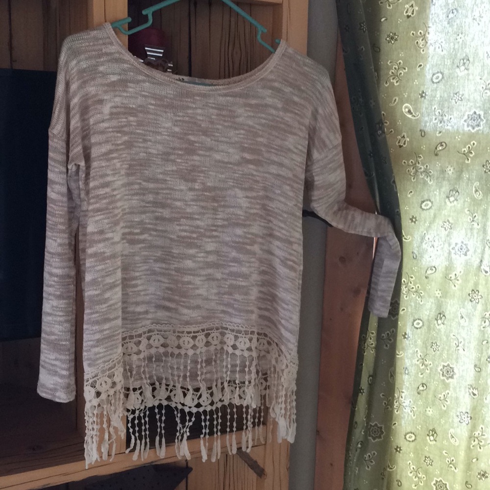 Spring sweater with crochet fringe on bottom